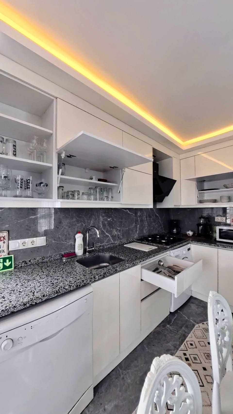 Family Condo, Balcony, City View | Private kitchen | Coffee/tea maker, cleaning supplies, paper towels