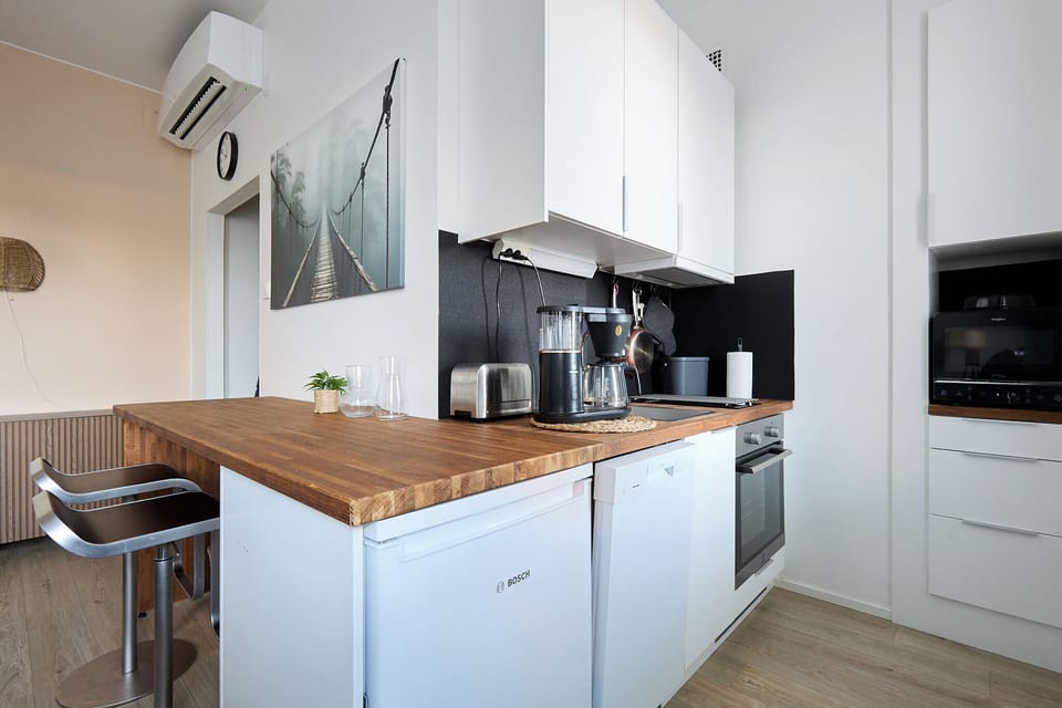 Apartment, City View | Private kitchen | Full-size fridge, microwave, oven, stovetop
