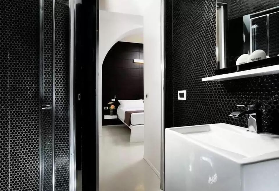 Standard Double Room, Courtyard View | Bathroom | Shower, hair dryer, towels, soap