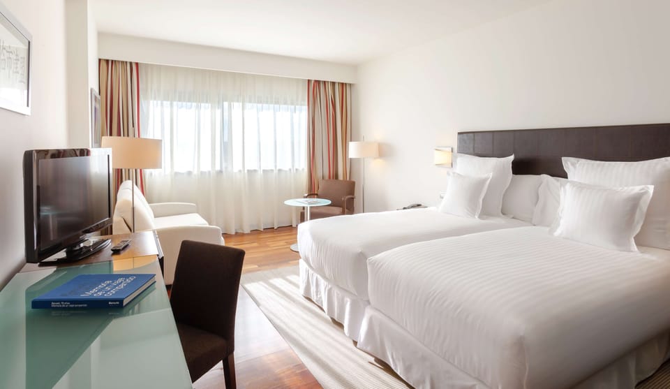 Hypo-allergenic bedding, down comforters, pillowtop beds, minibar