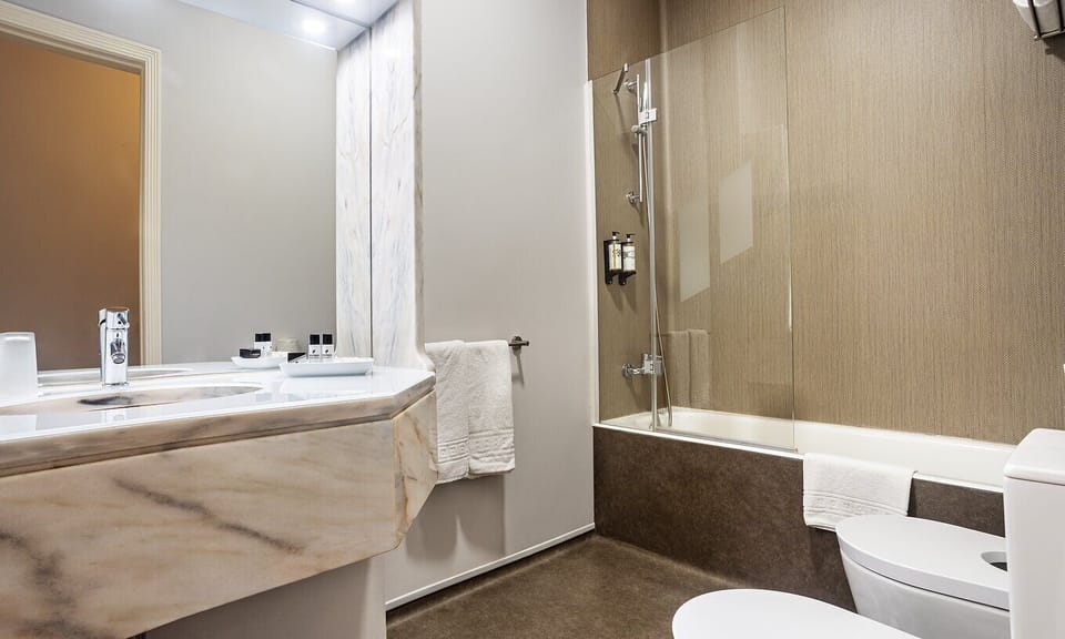 Separate tub and shower, eco-friendly toiletries, hair dryer, bidet