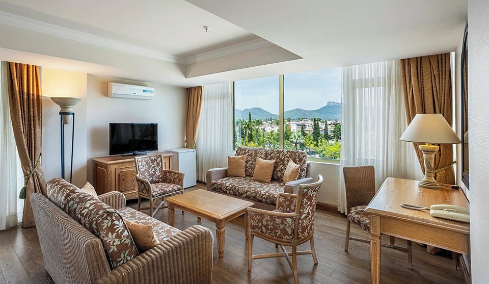 Comfort Deluxe Suite Land View Room | Living area | 55-inch LCD TV with satellite channels