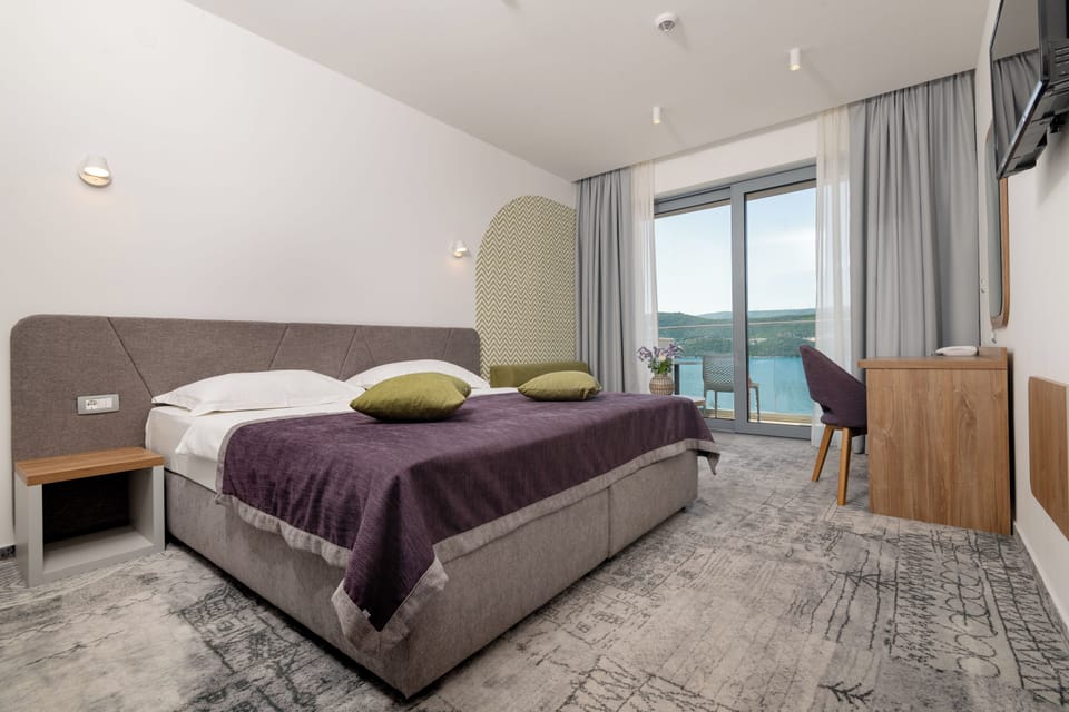 Deluxe Double or Twin Room, Balcony, Sea View | In-room safe, desk, laptop workspace, soundproofing