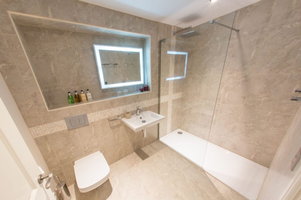 Designer toiletries, hair dryer, towels