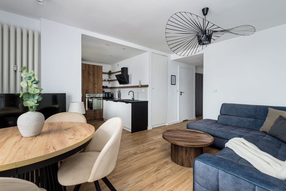 Deluxe Apartment, City View | Living area | 50-inch Smart TV with cable channels, offices