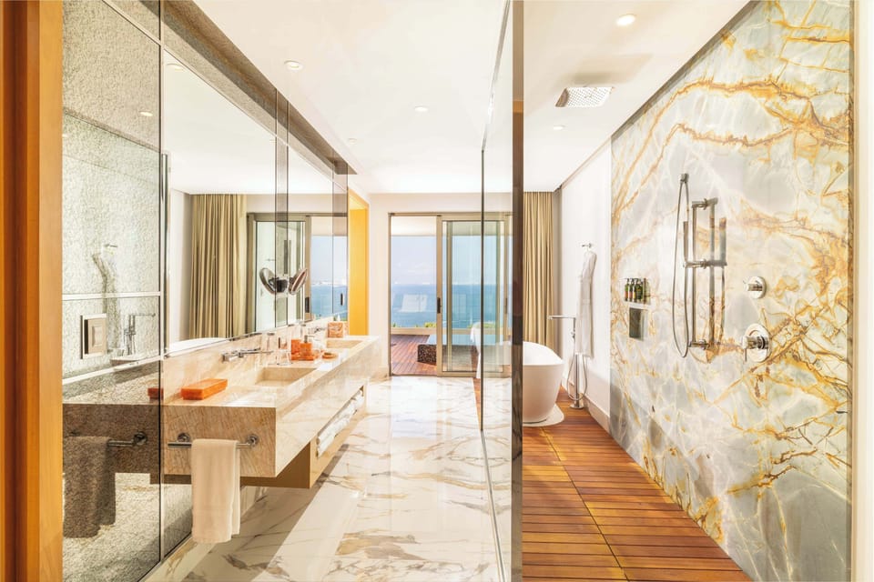 Sanctuary Two Bedroom Suite | Bathroom | Hair dryer, slippers, towels, soap