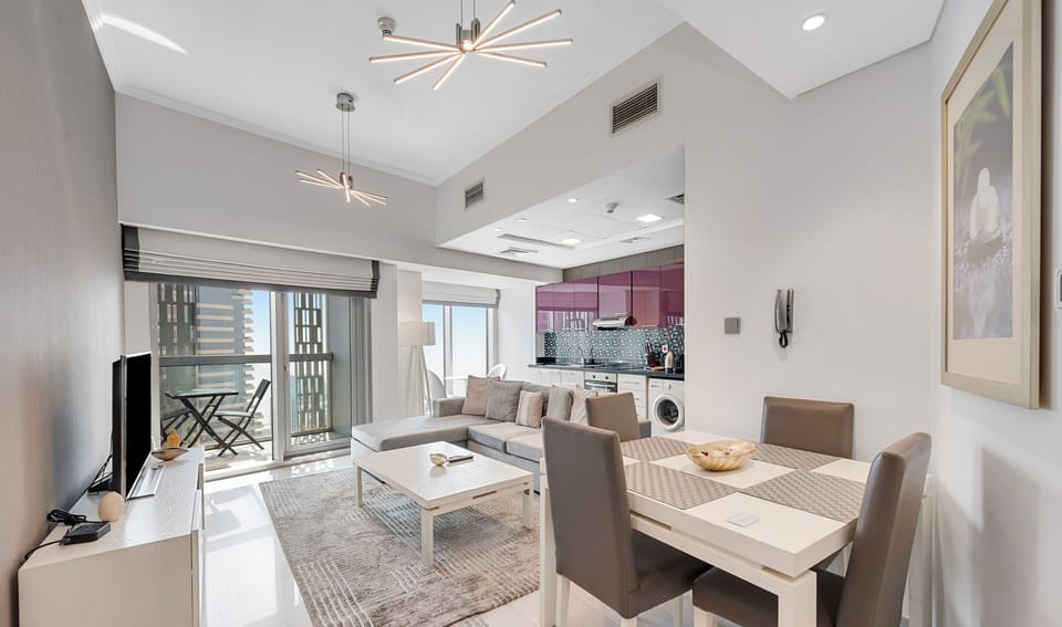 Deluxe Apartment, Sea View | Living area | TV