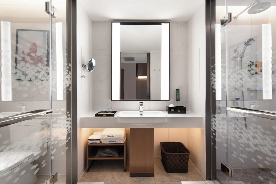 Shower, hair dryer, towels, shampoo