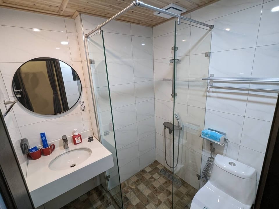 Shower, rainfall showerhead, eco-friendly toiletries, hair dryer