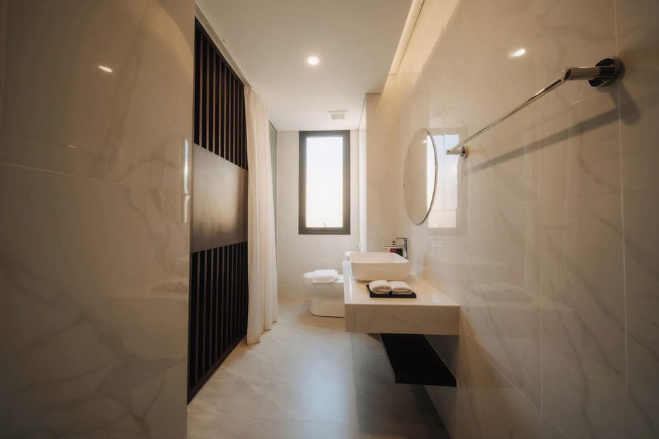 Shower, rainfall showerhead, designer toiletries, hair dryer