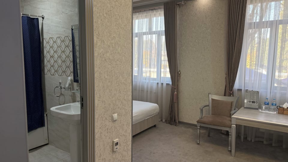 Deluxe Double Room, City View | Minibar, desk, WiFi (free), bed sheets