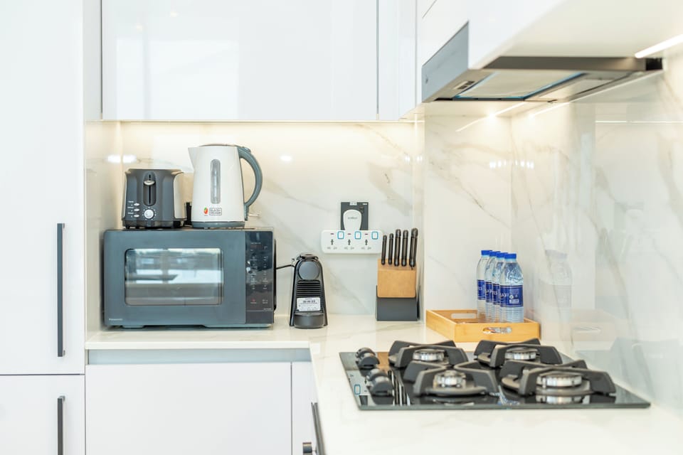 Exclusive Apartment, City View | Private kitchen | Full-size fridge, microwave, oven, stovetop