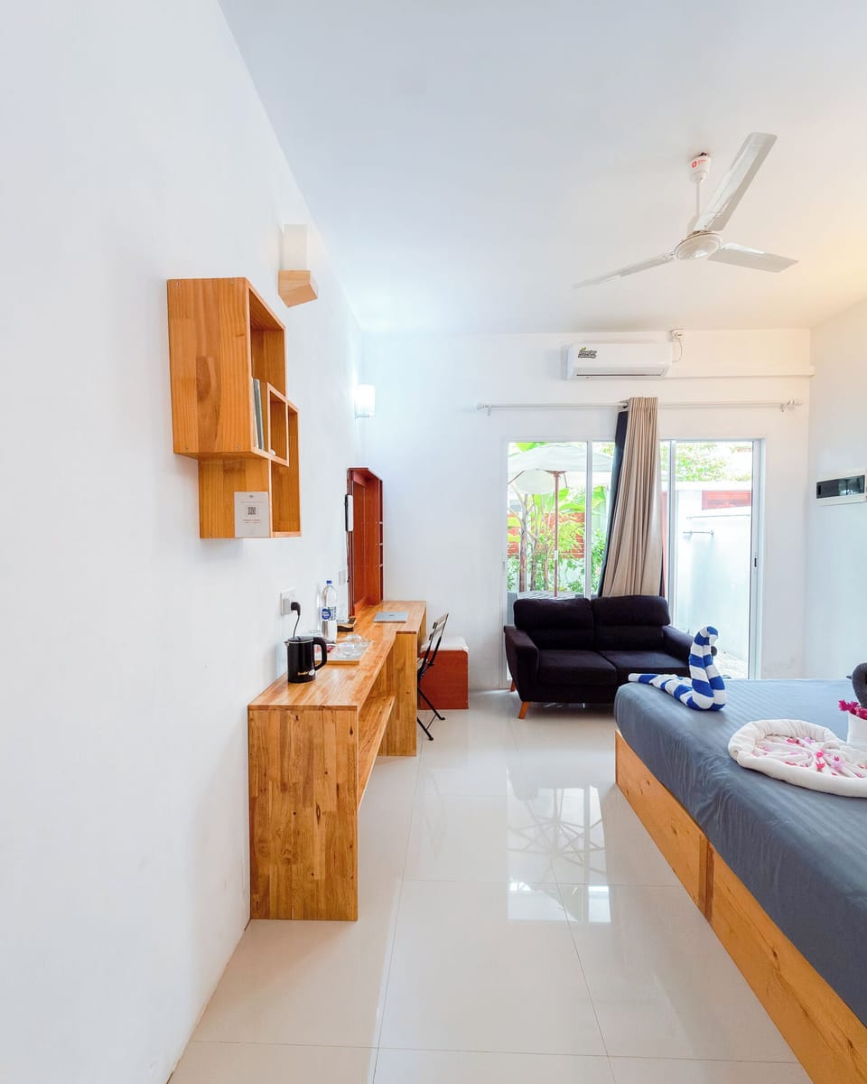 Deluxe Double Room, Patio, Garden View | In-room safe, blackout drapes, iron/ironing board, free WiFi