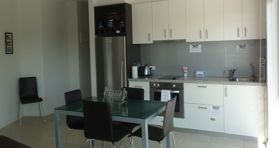 Executive Apartment, 2 Bedrooms, Balcony, Partial Ocean View | Private kitchen | Full-size fridge, microwave, stovetop, dishwasher