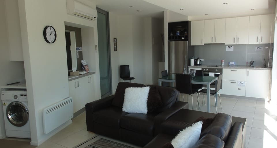 Executive Apartment, 2 Bedrooms, Balcony, Partial Ocean View | Living area | 49-inch flat-screen TV with digital channels, Smart TV, Netflix