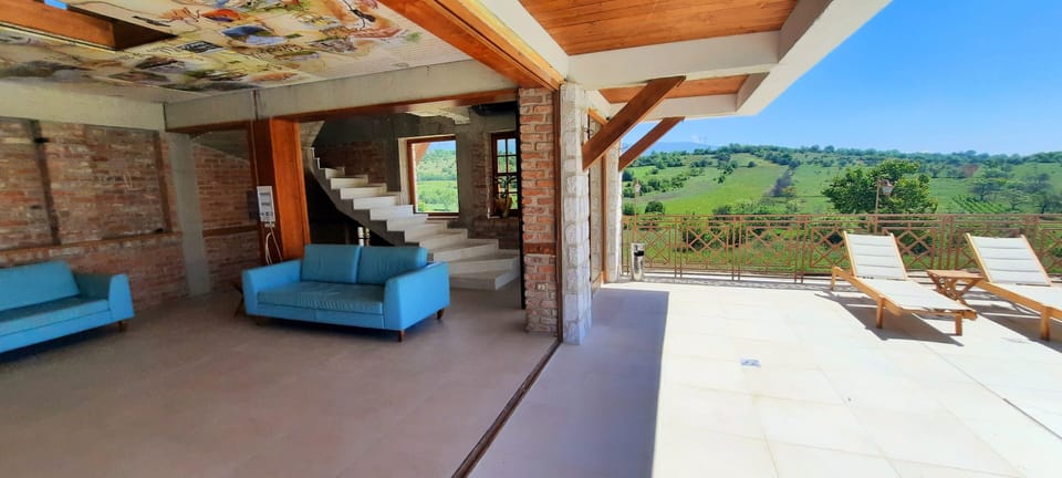 Deluxe Villa | Living area | 5-inch Smart TV with cable channels, heated floors