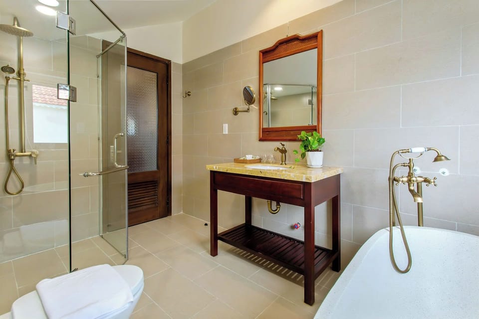 Family Room with River View | Bathroom | Hair dryer, slippers, towels, soap