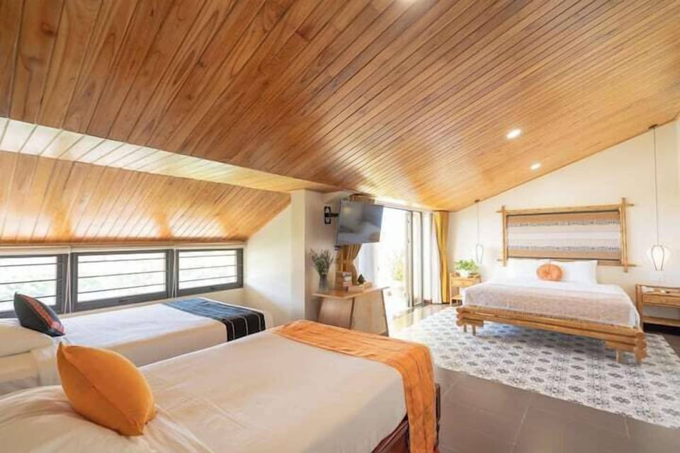 Family Room with River View | Minibar, desk, laptop workspace, blackout drapes
