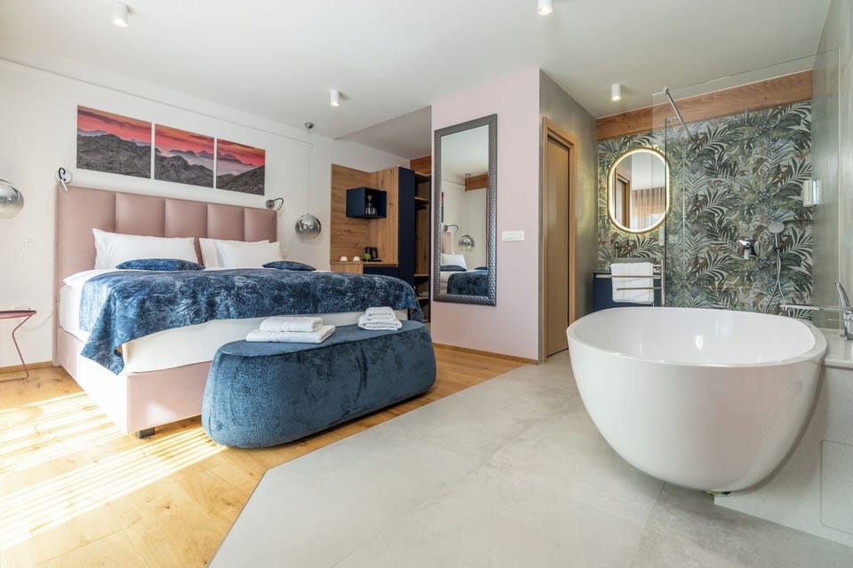 Deluxe Double Room, Balcony, Mountain View | In-room safe, blackout drapes, soundproofing, iron/ironing board