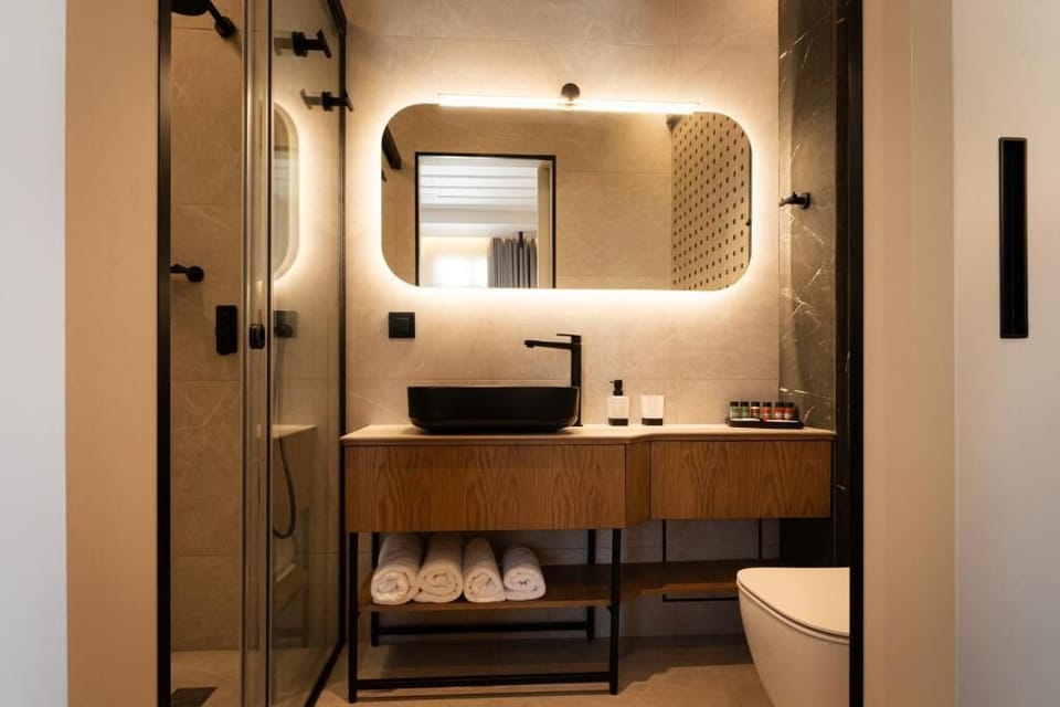 Suite, Balcony, City View | Bathroom | Shower, hair dryer, towels, soap