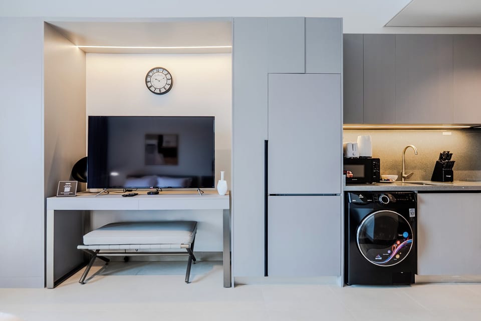 Deluxe Studio, Balcony, City View | Living area | 55-inch Smart TV with digital channels