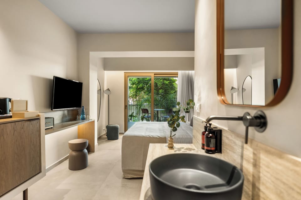 Junior Suite, Garden View | In-room safe, soundproofing, iron/ironing board, WiFi (free)