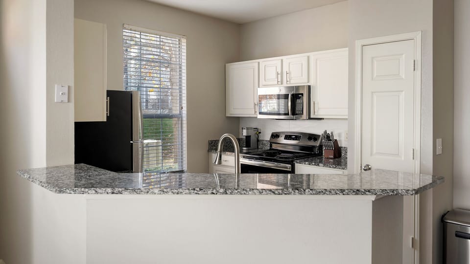 Apartment (1 Bedroom) | Private kitchen | Fridge, microwave, oven, stovetop