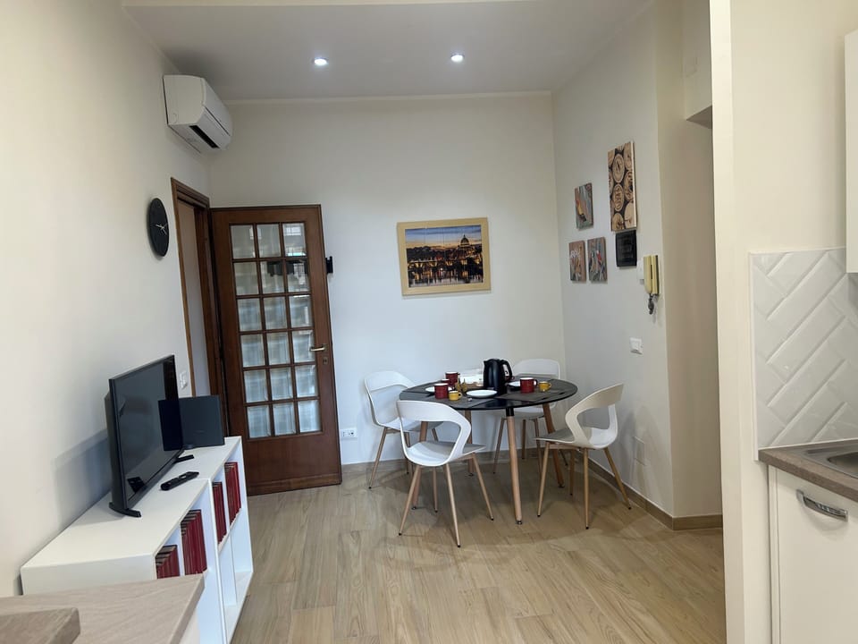Apartment (1 Bedroom) | Living area | 32-inch flat-screen TV with cable channels