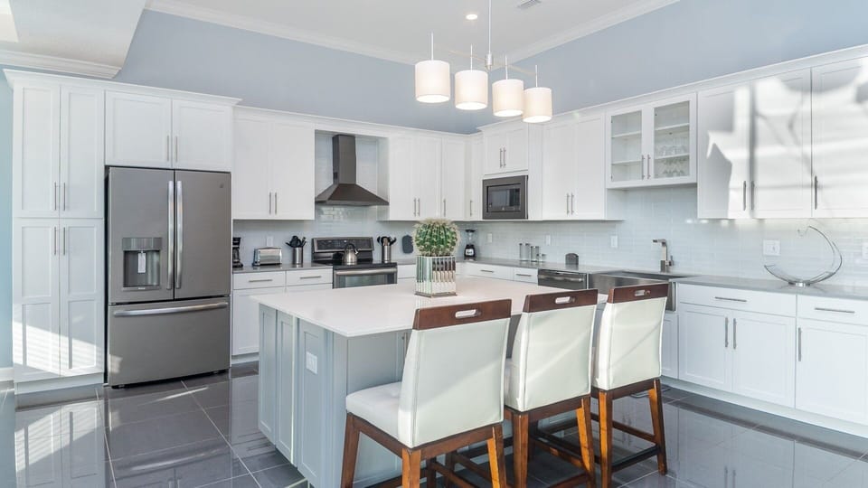 Condo, 4 Bedrooms | Private kitchen | Fridge, oven, coffee/tea maker, toaster