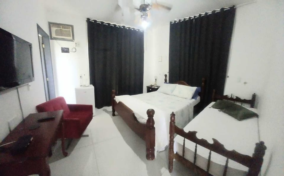 Deluxe Suite, Garden View | Blackout drapes, iron/ironing board, free WiFi