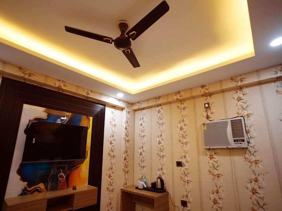 Luxury Suite, City View | Desk, laptop workspace, iron/ironing board, free WiFi