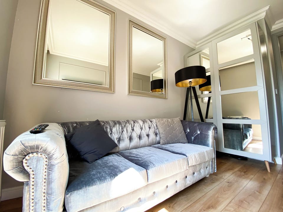 Luxury Apartment, Courtyard View | Living area | Flat-screen TV