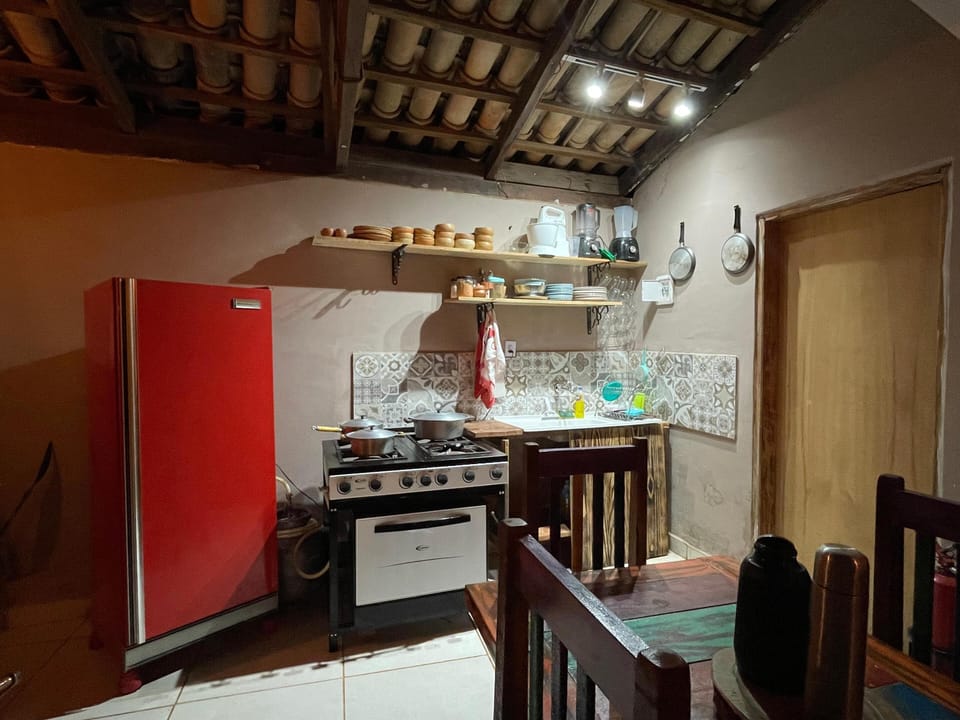 Full-size fridge, stovetop, cookware/dishes/utensils