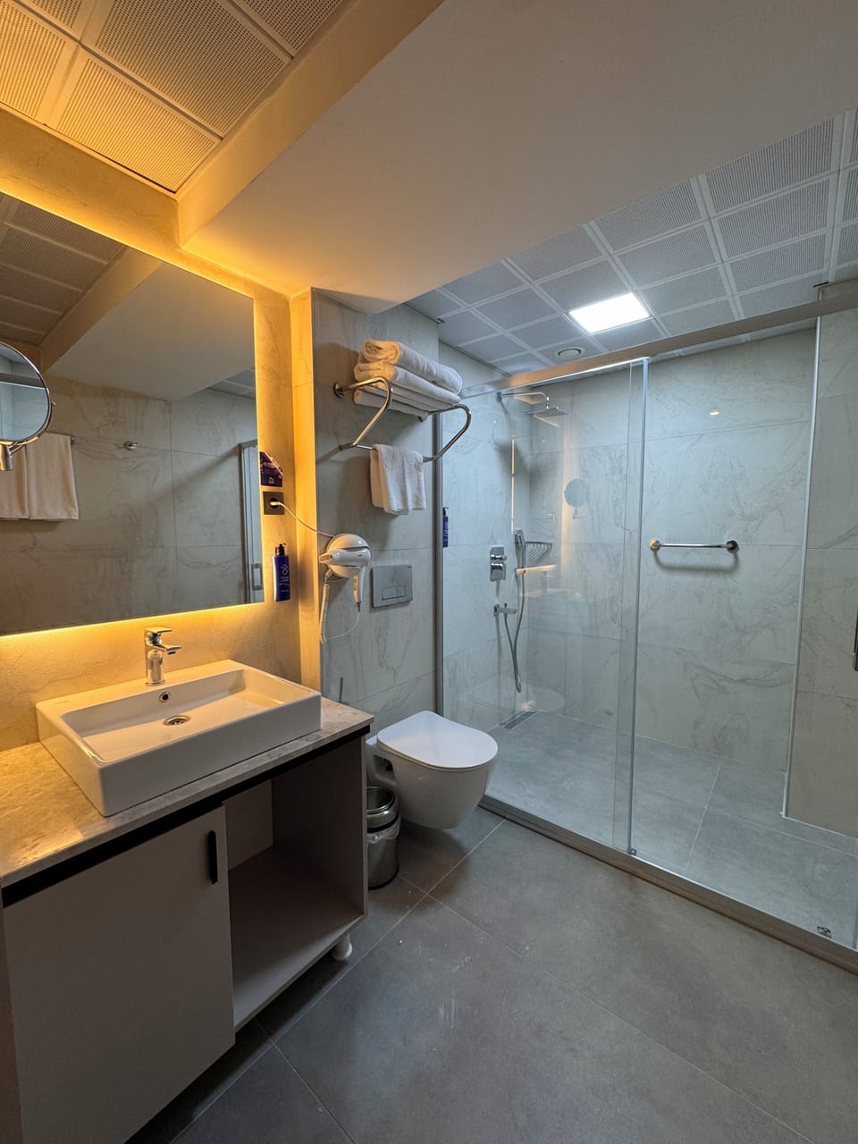 Shower, free toiletries, hair dryer, slippers