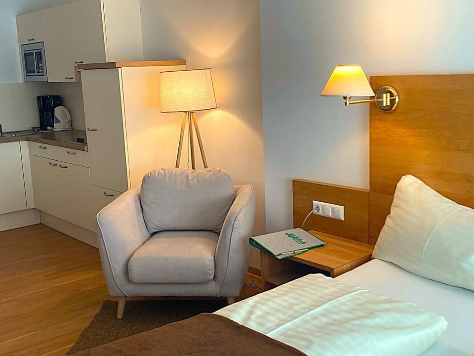 Classic Studio, Balcony, Lake View | Living area | Flat-screen TV