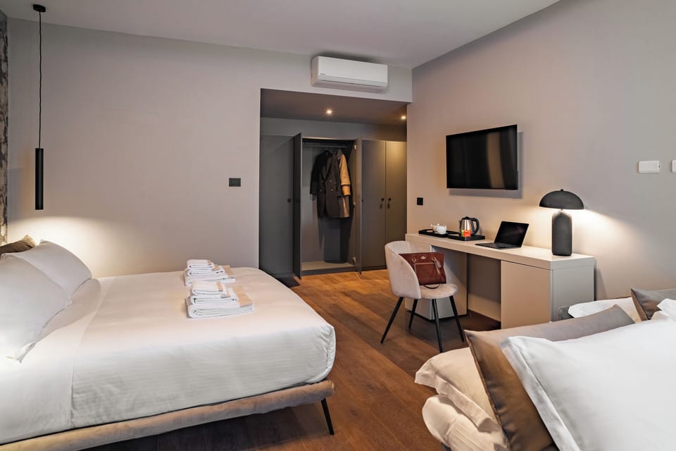 Luxury Quadruple Room, Balcony | Minibar, in-room safe, desk, laptop workspace