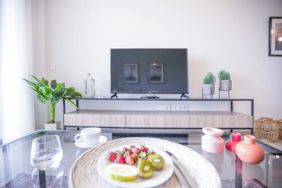 Apartment, 2 Bedrooms, Kitchen, City View | Living room | 55-inch Smart TV with cable channels, streaming services