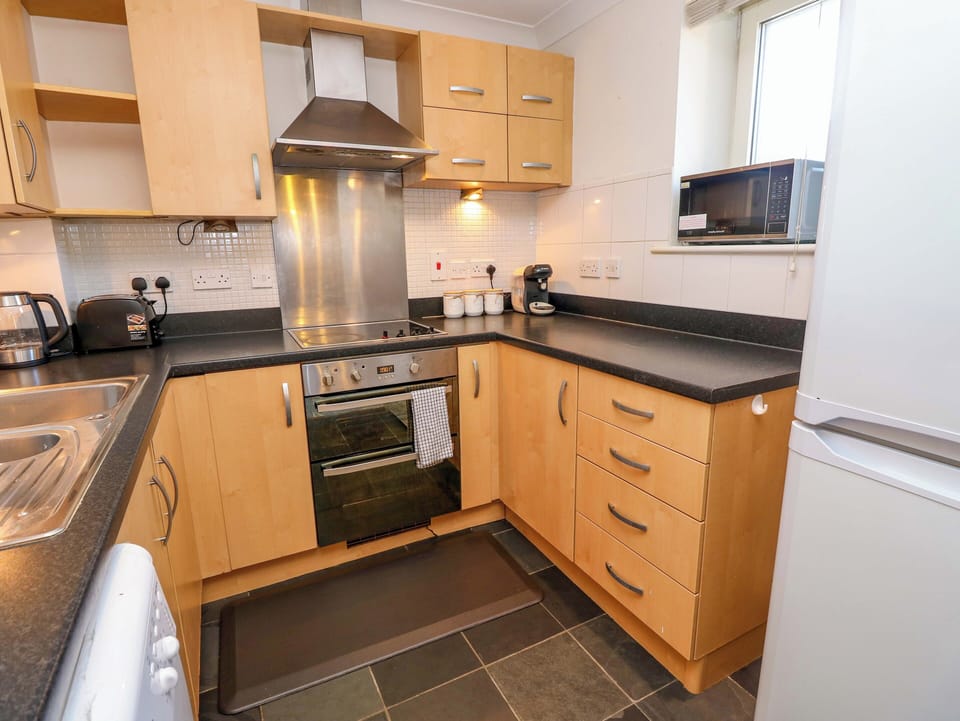 Fridge, microwave, toaster, cookware/dishes/utensils