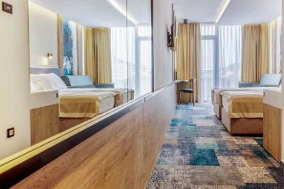 Deluxe Double or Twin Room, 1 Bedroom, Sea View | In-room safe, desk, laptop workspace, blackout drapes