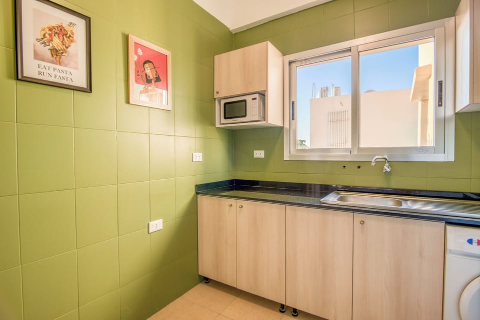 Apartment, 2 Bedrooms, Balcony, City View | Private kitchen | Full-size fridge, microwave, oven, stovetop