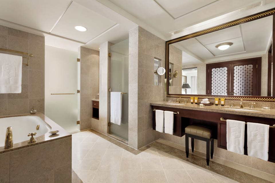 Suite, 1 Bedroom, Sea View | Bathroom | Separate tub and shower, hair dryer, bathrobes, slippers