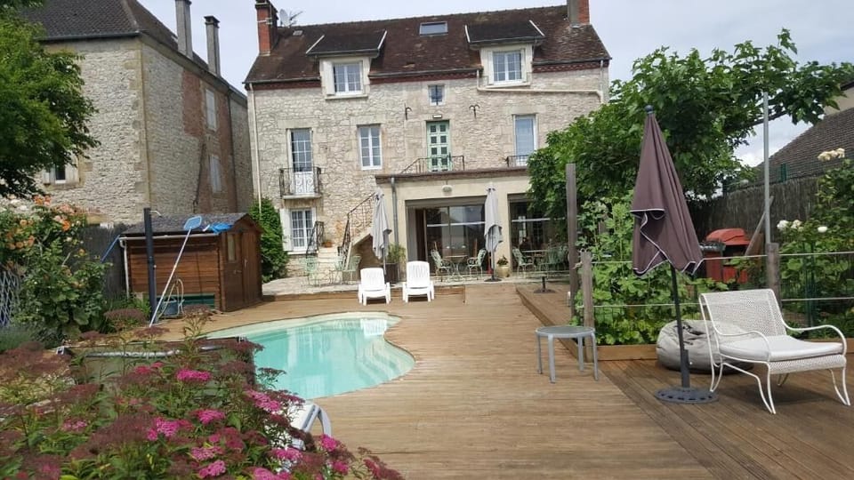 Seasonal outdoor pool, open 9:00 AM to 10:00 PM, pool umbrellas