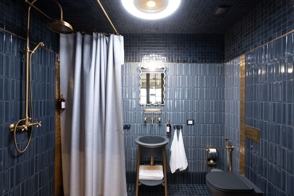 Deluxe Apartment, Garden View | Bathroom | Shower, hair dryer, towels, soap