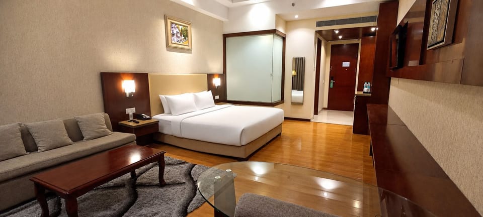 Deluxe Room, 1 Double Bed, City View | Minibar, desk, laptop workspace, blackout drapes