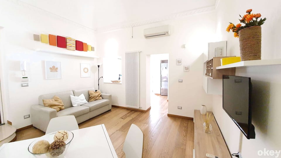 Apartment, Garden View | Living area | Flat-screen TV