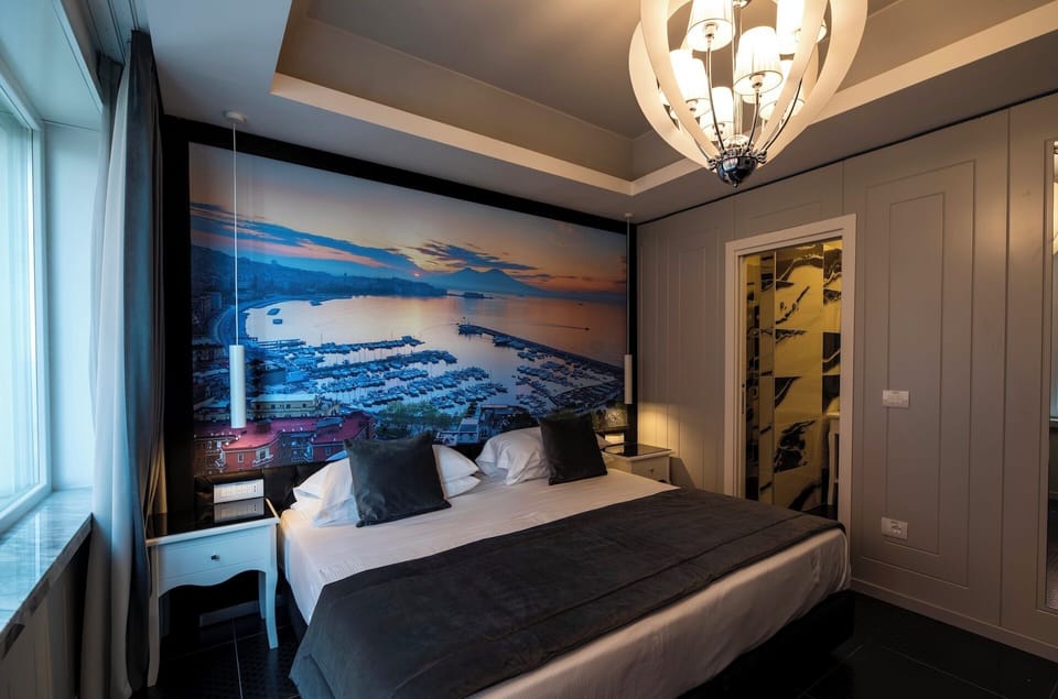 Deluxe Double Room, Partial Sea View | Minibar, in-room safe, free WiFi, bed sheets