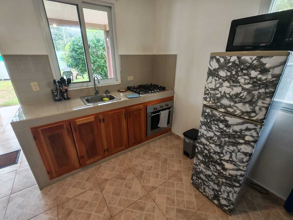 Apartment, Garden View, Poolside | Private kitchen | Dining tables