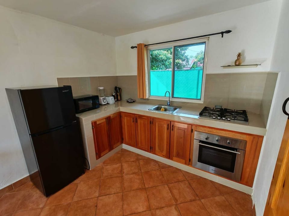 Apartment, Garden View, Poolside | Private kitchen | Dining table