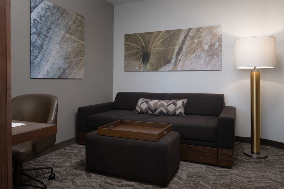 Premium bedding, desk, laptop workspace, iron/ironing board
