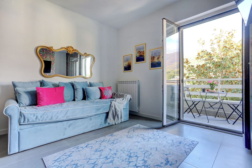 Apartment, Balcony, Mountain View | Living area | Flat-screen TV